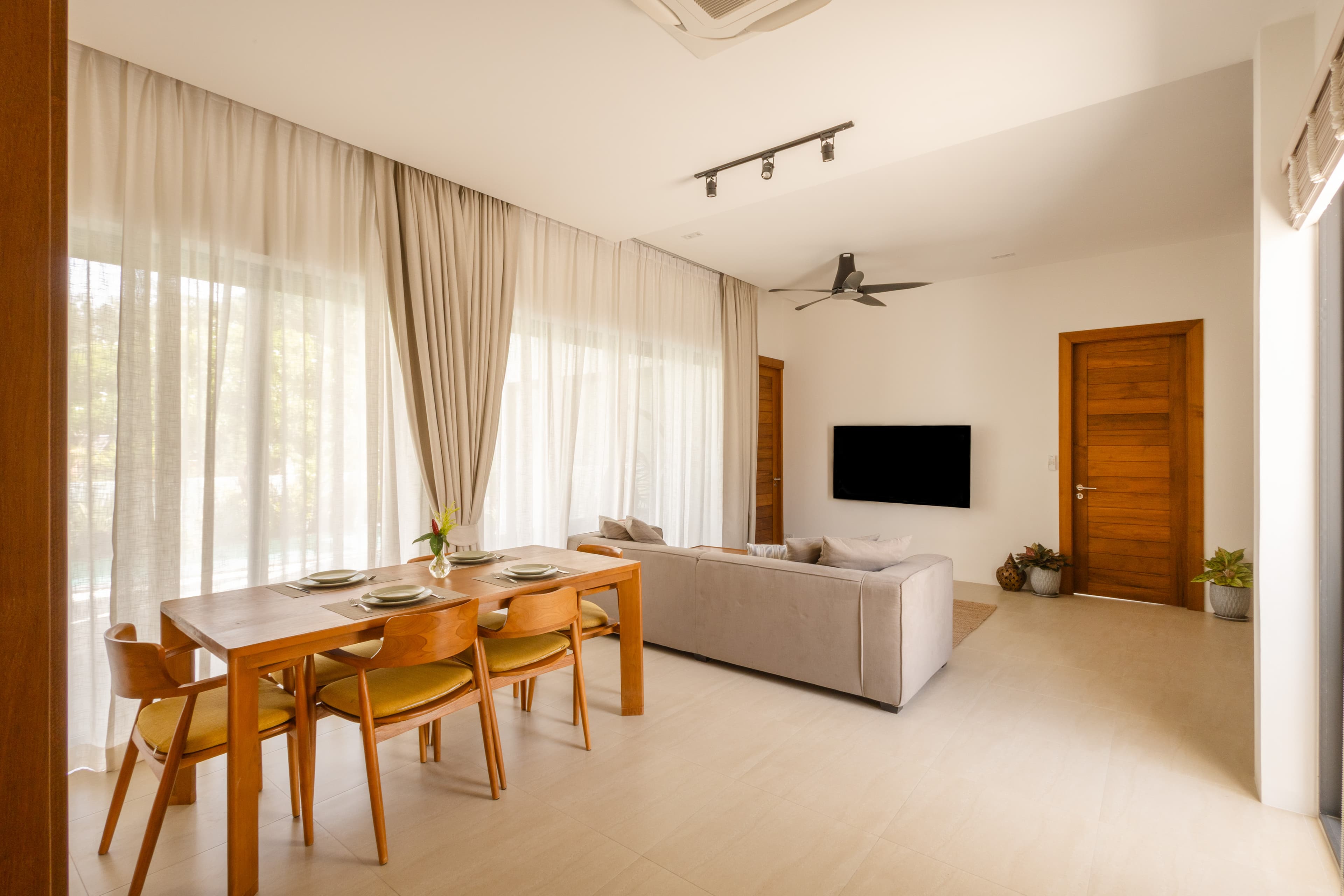 Open-plan dining and living area — Barefoot Villas