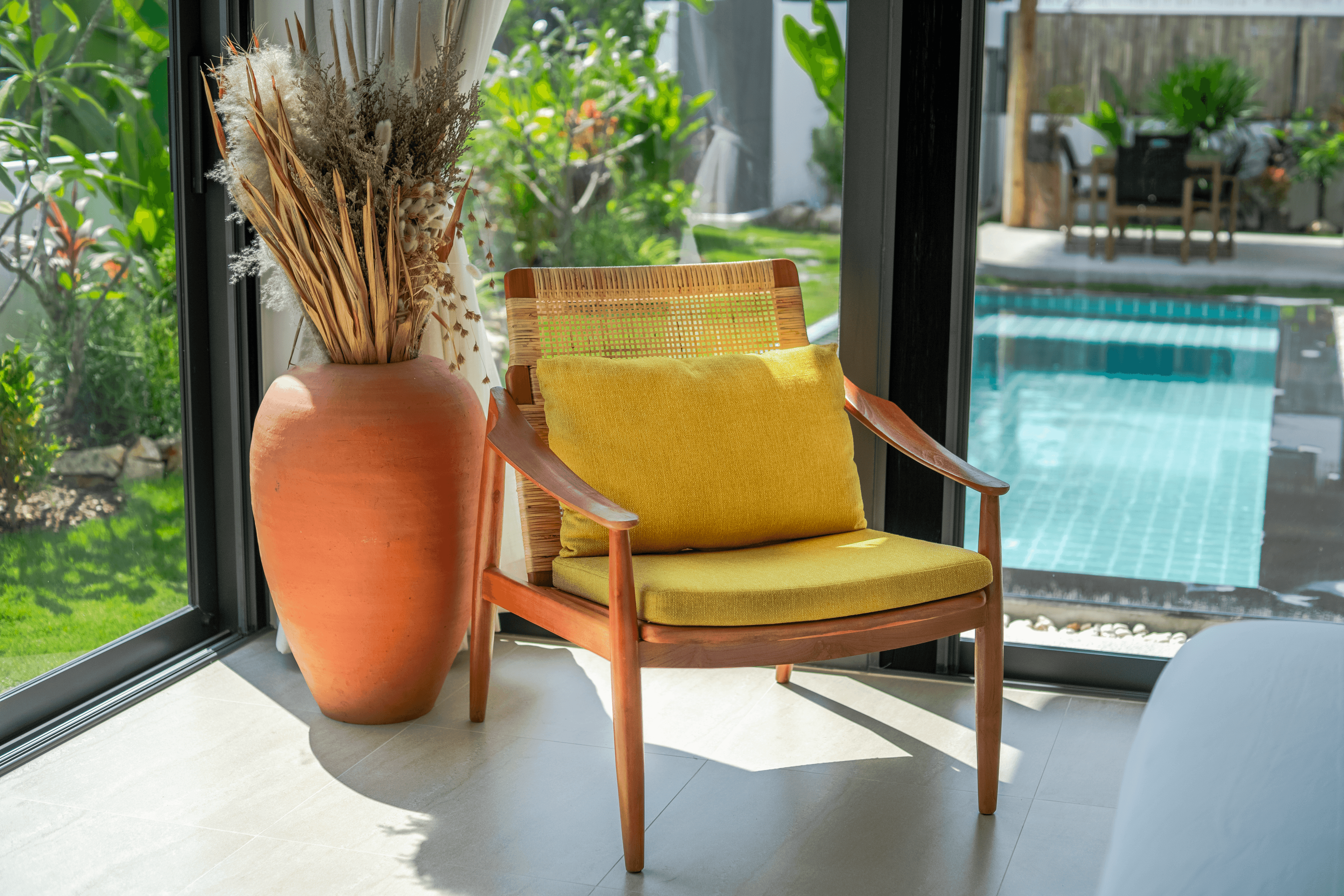 Armchair with pool view — Barefoot Villas