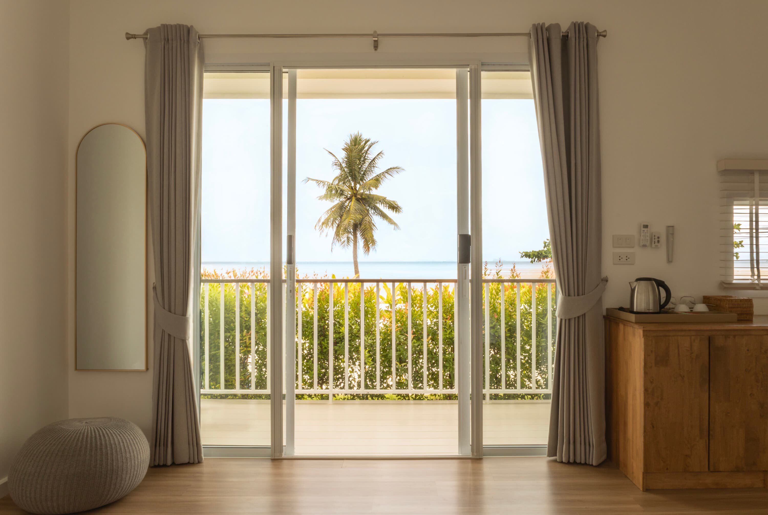 Row of beachfront units with tropical gardens — Caya Beach