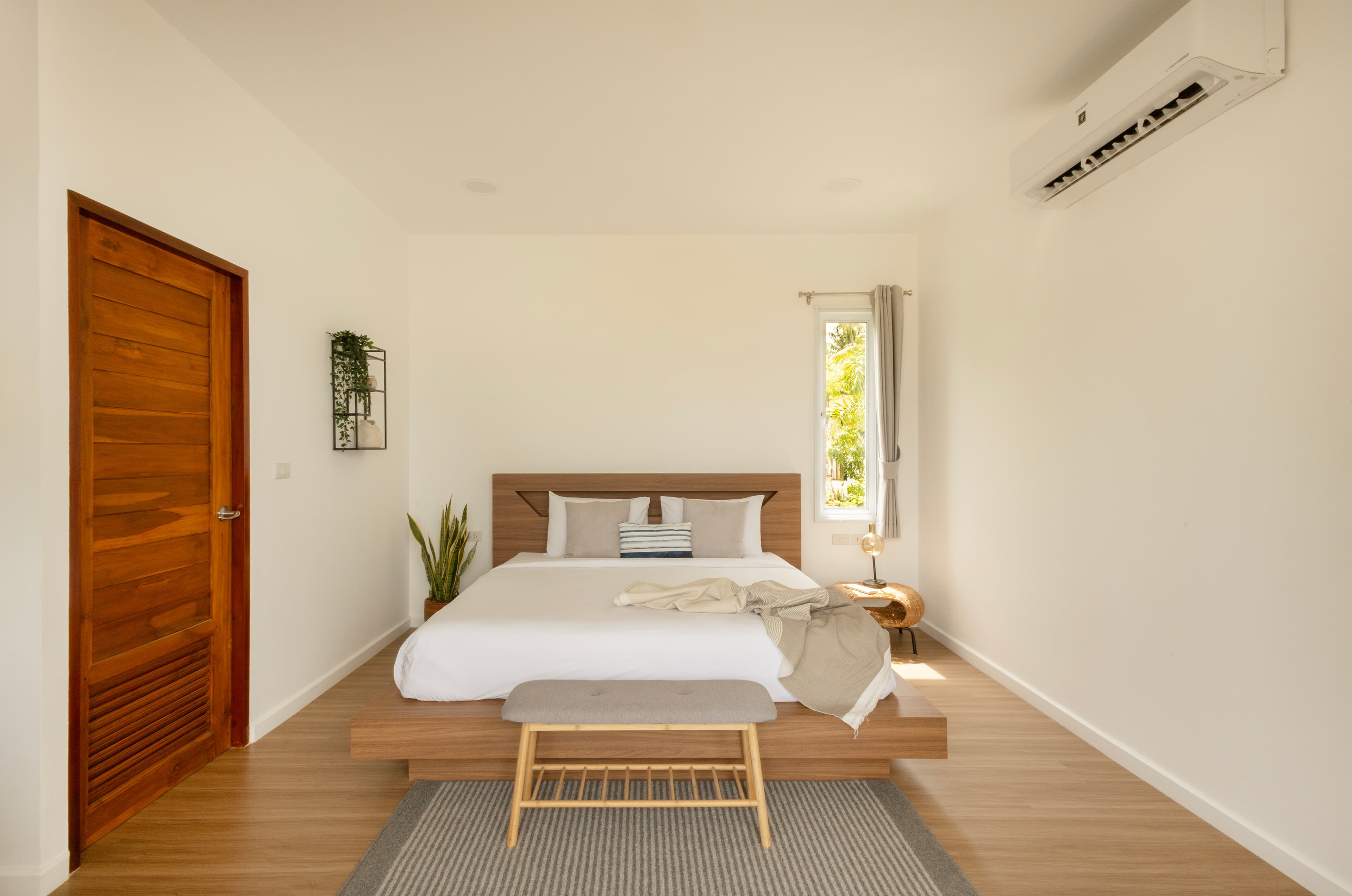 Equipped kitchenette with bamboo blinds and natural light — Caya Beach