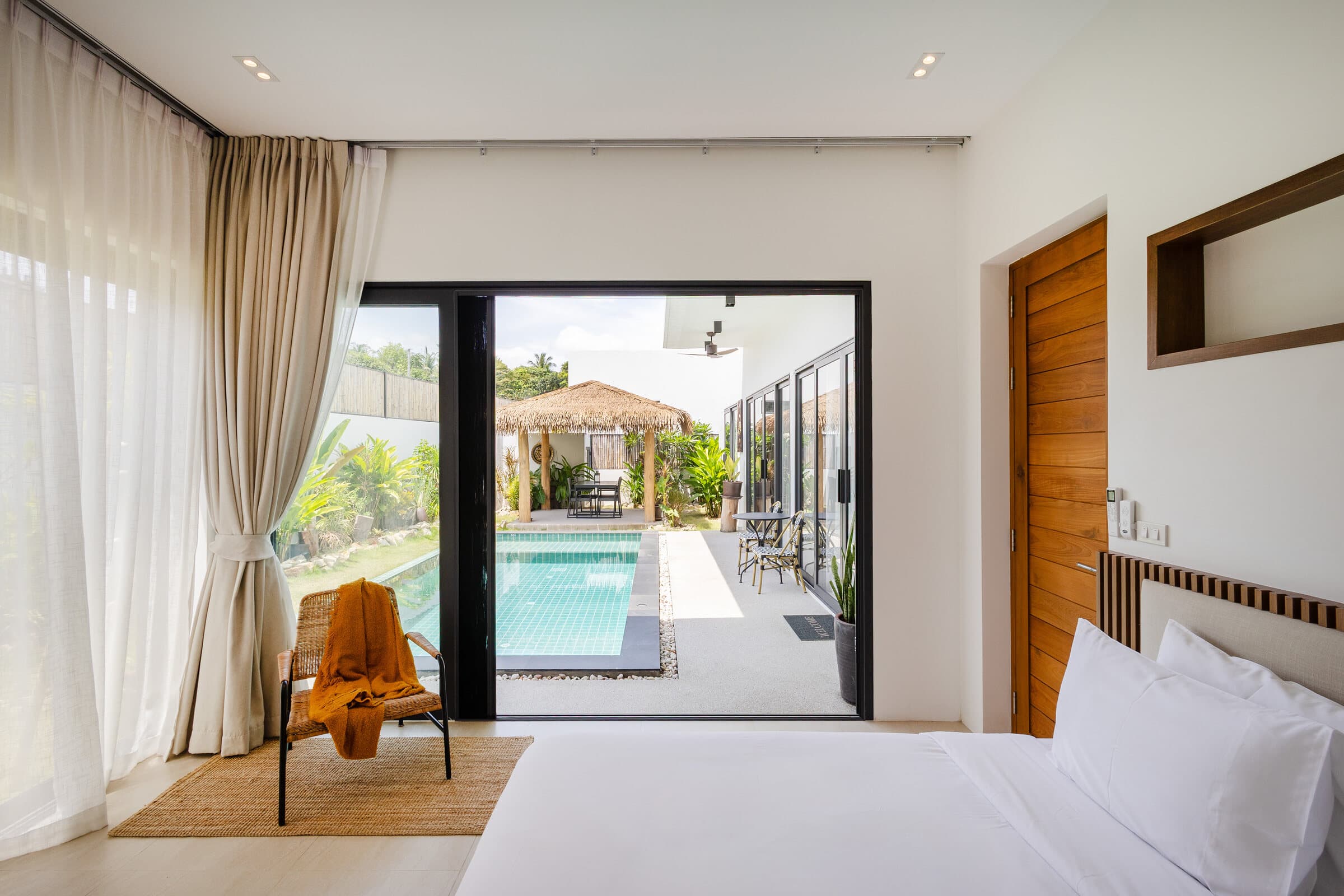 Master bedroom opening directly to the private pool — Barefoot Villas