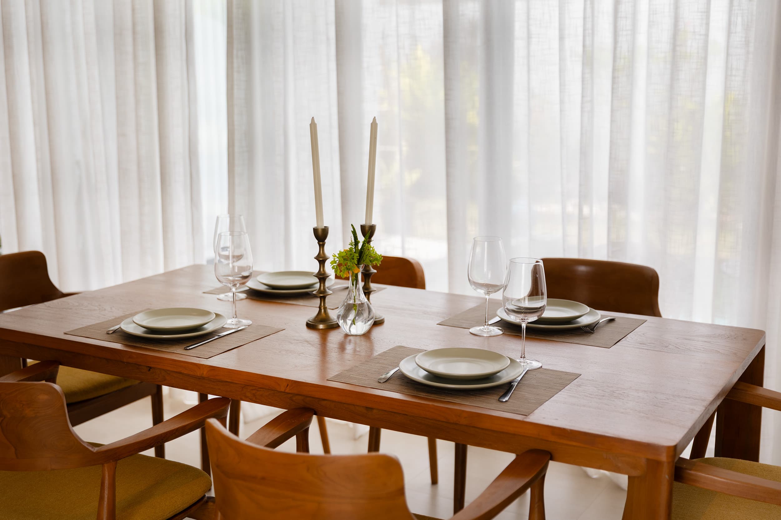 Candlelit dining table set for the evening — Barefoot Villas