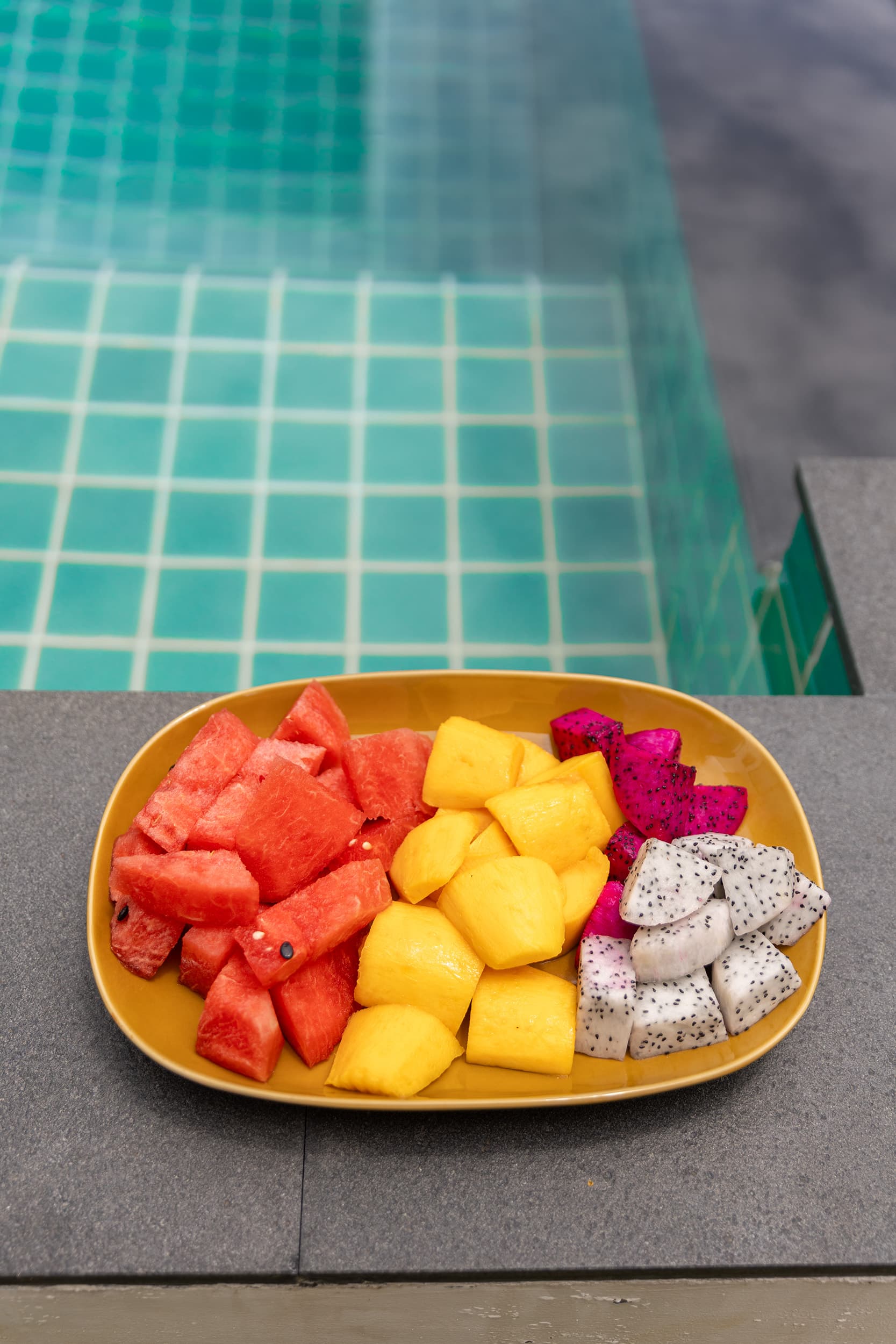 Tropical fruit plate on the pool deck — Barefoot Villas