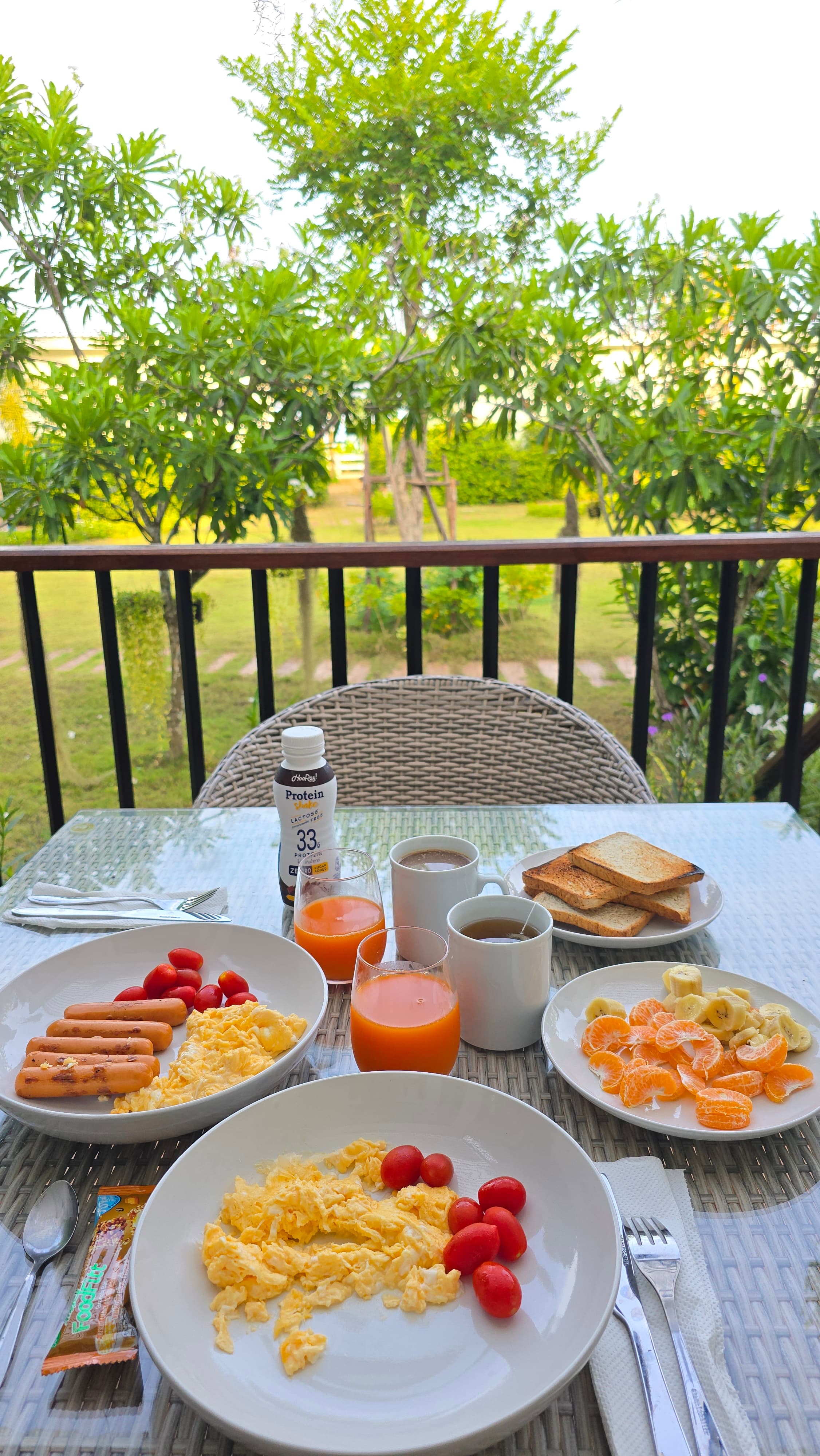 Balcony breakfast with tropical garden views — Caya Beach by Satori
